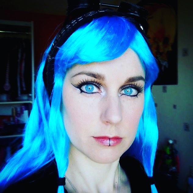 Me. Debbie Maasdam. With blue eyes of my own. Blue hair from a wig. Makeup by me.