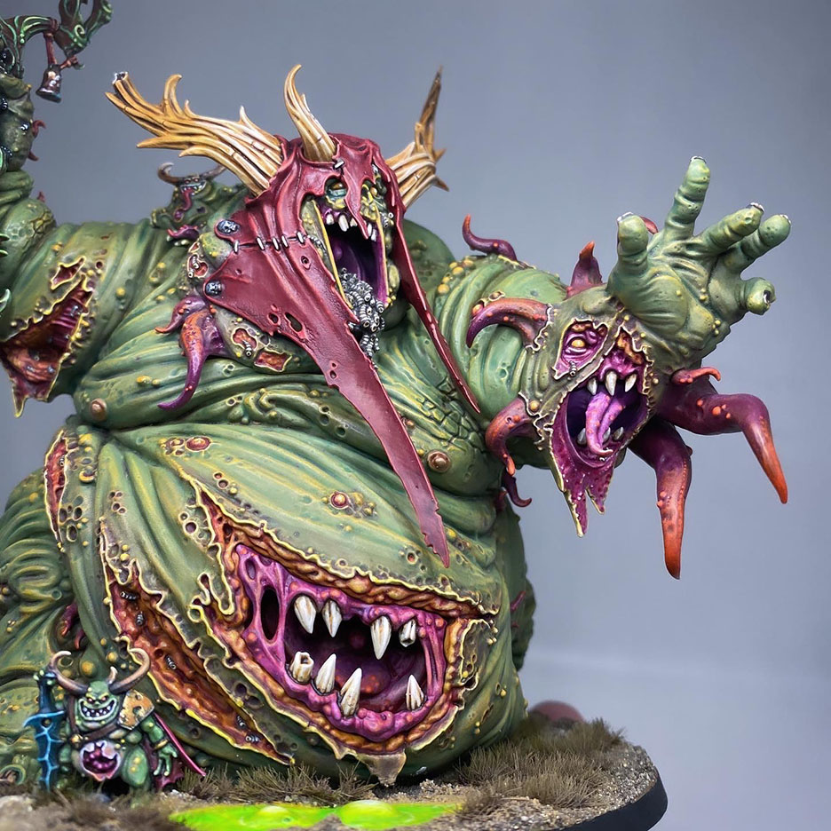 The Great Unclean One / Rotigus is built and painted. There are 3 different distinct builds for AOS and 40K. I have magnetized all the parts of the Great Unclean One and Rotigus. We now have 3 different heads, 3 left arms, 3 right arms and 2 stomach inserts. This way, you can play any variant you want. This is a truly vile model (in the most positive sense of the word!) – it celebrates its corpulence, with rotten, torn flesh slipping aside on its enormous gut to reveal winding intestines within. What an awesome model. Those details are perfectly gruesome. Warhammer - Age of Sigmar and 40K Maggotkin of Nurgle. 👉 Do you want me to build or paint for you? Feel free to contact me. I am excited to hear from you! Height: 13 cm (without weapons) Patching: Green Stuff by citadel_paints Base: custom made with clay Paints: vallejocolors Painted to level: Display Publisher: warhammerofficial Painted by: Debbie Maasdam
