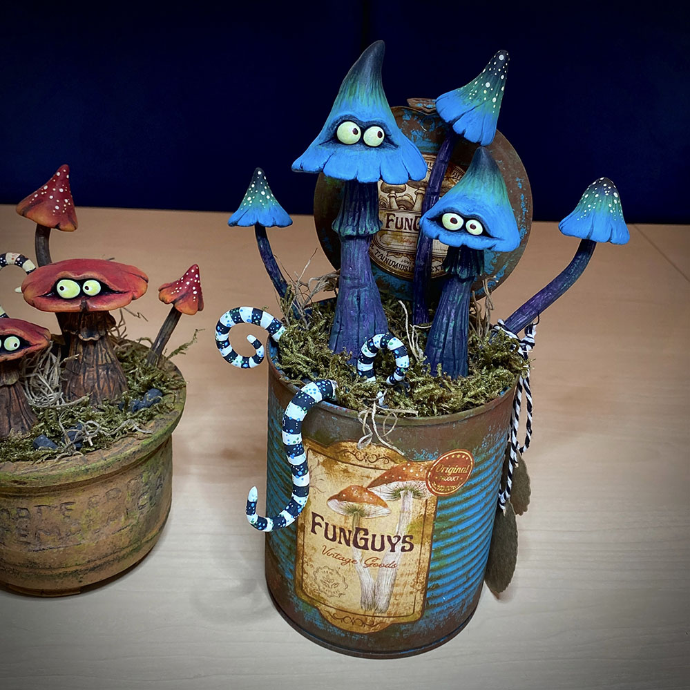 I sculpted and painted these ‘FunGuys’ (funny looking fungi😉). I was inspired by one of my favorite artists, Tim Burton. I sculpted these fellows in air-dry clay. Gave them a pot/can and decorated it with stones and plants. In the realm of whimsical enchantment lies a duo of sculpted miniature toadstools, known as ‘FunGuys,’ whose very name reflects their playful nature. These captivating creations possess an aura of Tim Burtonesque charm. These adorable FunGuys are not mere sculptures; they are portals into a world of imagination and whimsy, beckoning us to embrace the whimsical and find laughter in the ordinary. #funguy #funguys #fungi #fungi_fan_club #funghi #fungiphotography #fungilove #fungifanatic #fungifreaks #fungilover #fungiart #fantasticfungi #guys #funnyguys #toadstool #sculpting #claysculpture #sculpture #sculptures #toad #toads #toadsofinstagram #sculpting #sculpture #sculptureart #mushrooms #mushroom #toadstools #sculpt #timburton #timburtonstyle #timburtonart